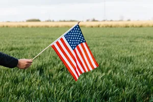 Glorious And Proud, The American Flag In Full Flutter Wallpaper
