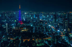 Glowing Blue Tower In Anime Night City Wallpaper