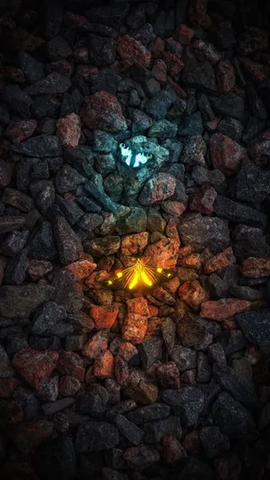 Glowing Elements Amidst Rocks Wallpaper
