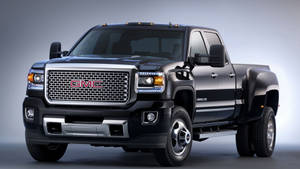 Gmc Black Sierra With Double Wheels Wallpaper