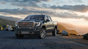 Gmc Car With Sunset View Wallpaper