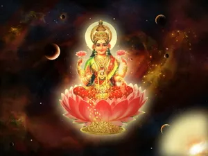Goddess_ Mahalakshmi_ On_ Lotus_ Flower Wallpaper
