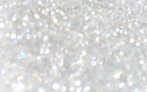 Gold And Silver Glitter Against A White Background Wallpaper