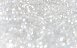 Gold And Silver Glitter Against A White Background Wallpaper