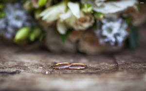 Gold Wedding Rings In Garden Wallpaper