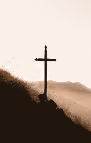 Golden Cross On A Hill At Twilight Wallpaper