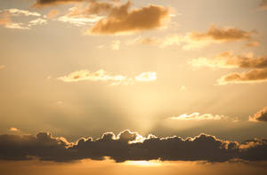 Golden Heavy Clouds 4k Sky Wallpaper