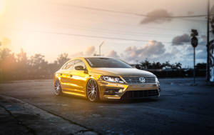 Golden Luxury On The Road: Dive Into Luxury Behind The Wheel Of The Volkswagen Passat Cc! Wallpaper