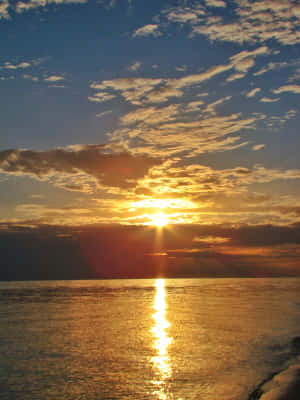 Golden Sunrise Over Ocean.jpg Wallpaper