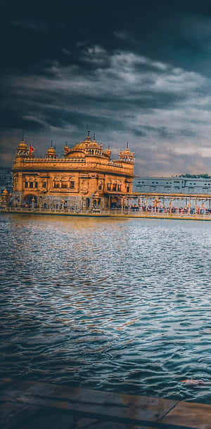 Golden Temple On A Stormy Day Wallpaper