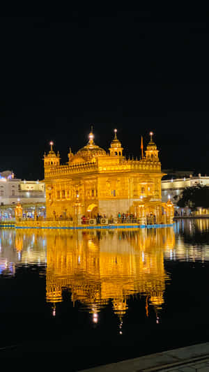 Golden Temple With Lights On Wallpaper