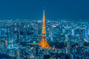 Golden Tokyo Tower Against Evening Sky Wallpaper