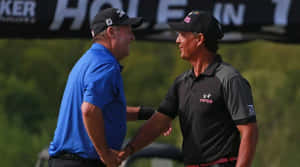 Golfers Handshakeat Tournament Wallpaper