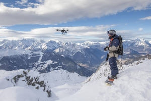 Gopro Mountain Climber On A Snowy Mountain Wallpaper