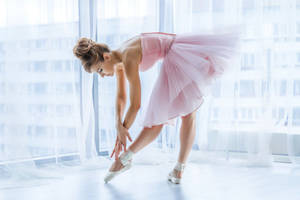 Graceful Ballerina In Pink Tutu Wallpaper