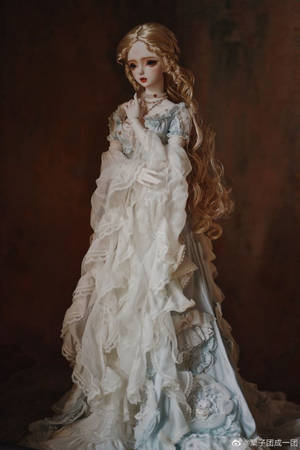 Graceful Barbie Doll Dressed In A Flowy Gown Wallpaper