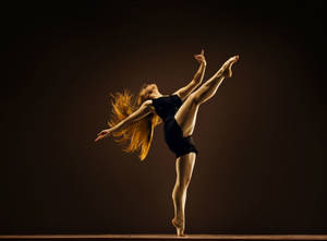 Graceful Performance By A Professional Ballet Dancer Wallpaper