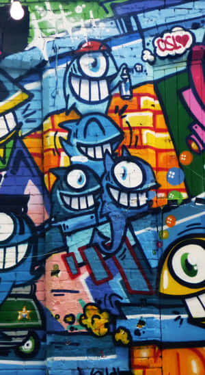 Graffiti Wall Art With One-eyed Creatures Wallpaper