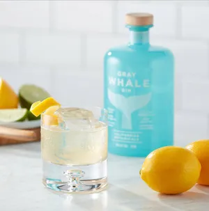 Gray Whale Gin Lemon And Bottle Wallpaper