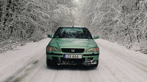 Green 4k Honda Civic In Snow Wallpaper