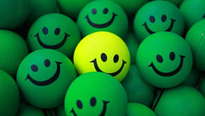 Green And Yellow Happy Stress Balls Wallpaper