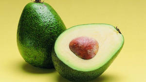 Green Avocado Fruit In Halves Still Shot Wallpaper