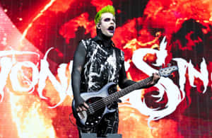 Green Haired Bassist On Stage.jpg Wallpaper