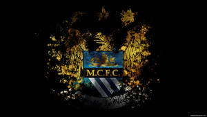 Gritty Black And Gold Manchester City Fc Logo Wallpaper