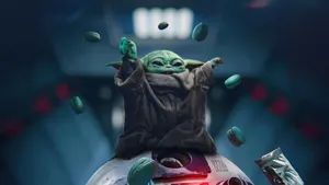 Grogu Using The Force With Macarons Wallpaper