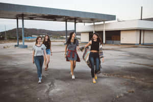 Group Of Friends Walking Away From Old Building Wallpaper