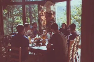 Group Of People Eating Together Wallpaper