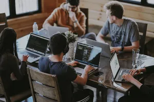 Group Of People Working Together Wallpaper