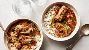 Gumbo Plates With Rice And Water Glasses Wallpaper