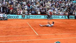 Gustavo Kuerten Lying On The Court Wallpaper