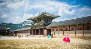 Gyeongbokgung Palace Tourists In Traditional Clothing Wallpaper
