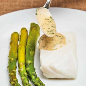 Halibut Steakwith Asparagusand Herb Sauce Wallpaper