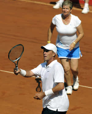 Hana Mandlikova Playing Tennis Together With Another Player Wallpaper