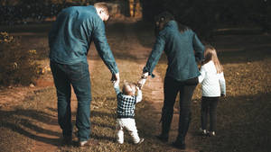 Hand In Hand Family Portrait Wallpaper