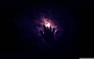 Hand Reaching Towards Universe Wallpaper