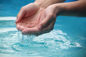 Hands Getting Water Wallpaper