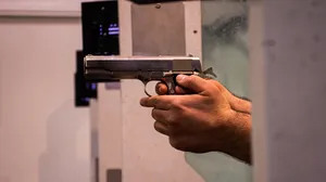 Hands Holding Gun Wallpaper