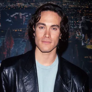 Handsome Brandon Lee In Leather Jacket Wallpaper