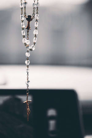 Hanging Rosary With Jesus On Cross Wallpaper