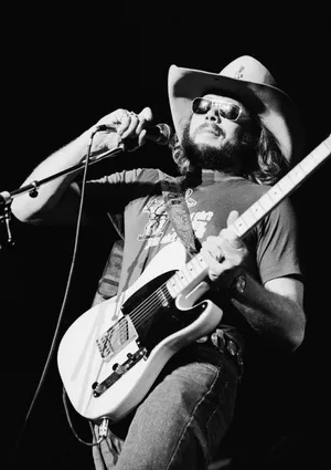 Hank Williams Jr Performing At A Live Music Concert Wallpaper