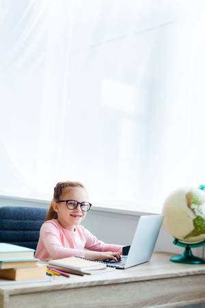 Happy Child Study With Laptop Wallpaper