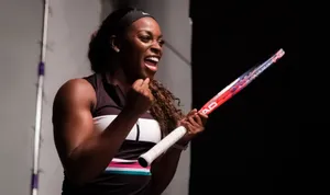 Happy Sloane Stephens Holding A Racket Wallpaper