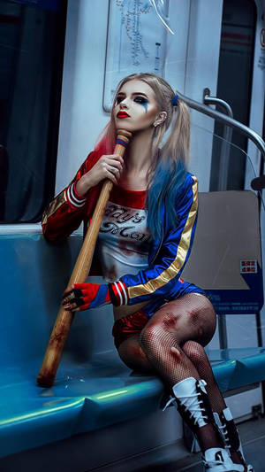 Harley Quinn Phone On Train Wallpaper