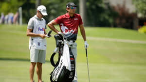 Harrison Frazar Teeing Off During A Golf Tournament Wallpaper