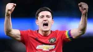 Harry Maguire Cheers With Both Arms Raised Wallpaper