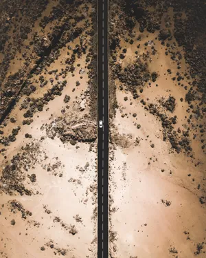 Hd Car On Desert Road Wallpaper